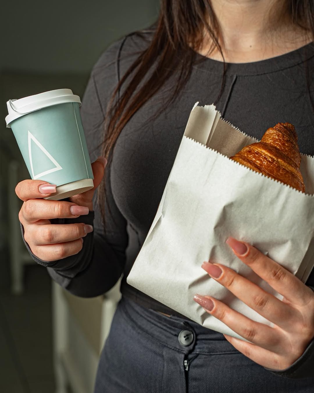 Pistachio tartlet beside a Korhan branded cup